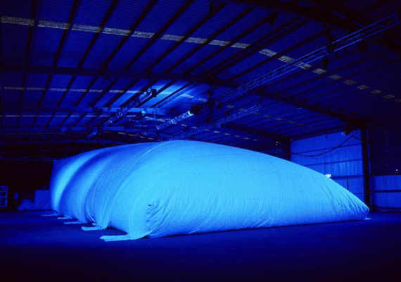 Featuring a venue like inflatable super-structure housed in a larger building. A sound design of individual open-ear headphone mixes for the audience.